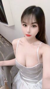 KL China Escort Bao Bao showing elegant silhouette in night dress.